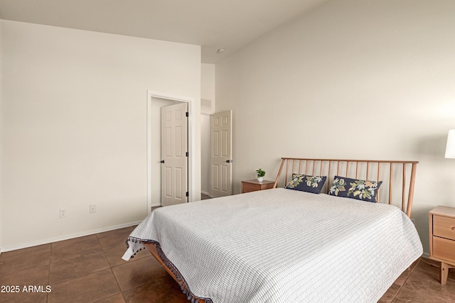 tiled bedroom featuring high vaulted ceiling and baseboards