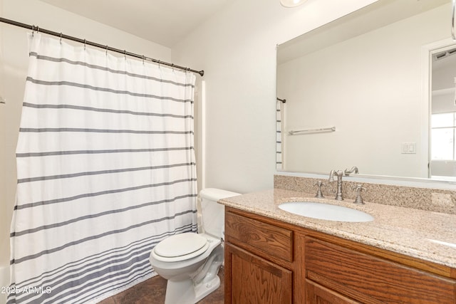 bathroom featuring a shower with curtain, visible vents, vanity, and toilet