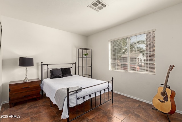 bedroom with baseboards and visible vents