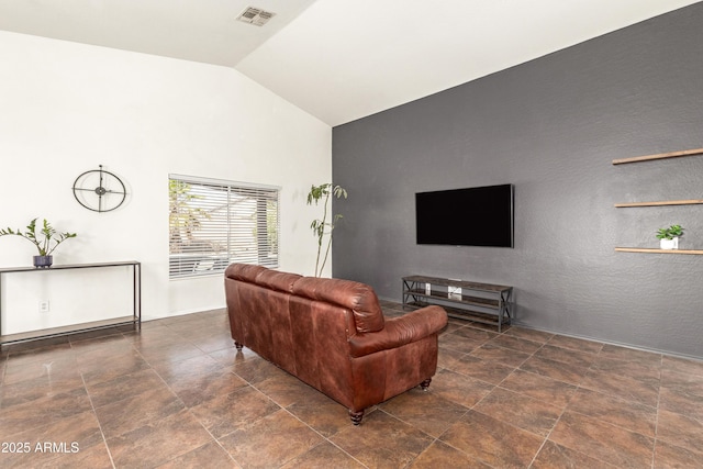 living room featuring visible vents and vaulted ceiling