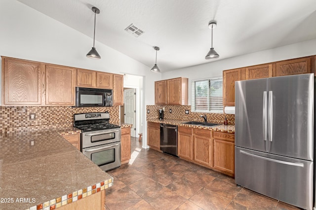 kitchen featuring a sink, visible vents, vaulted ceiling, hanging light fixtures, and appliances with stainless steel finishes