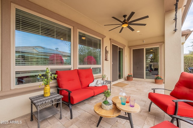 view of patio featuring ceiling fan