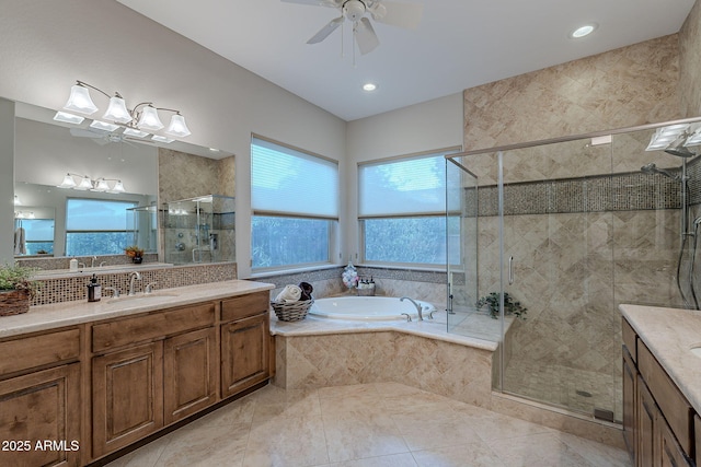 bathroom featuring independent shower and bath, vanity, tile patterned floors, and ceiling fan