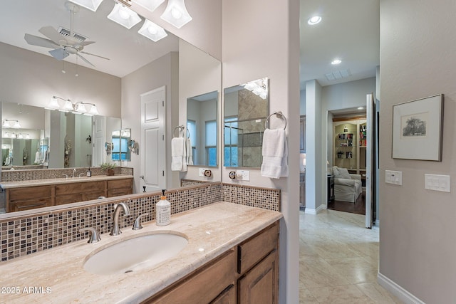 bathroom with tasteful backsplash, vanity, tile patterned floors, and ceiling fan