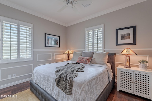 bedroom with ceiling fan, ornamental molding, and dark hardwood / wood-style floors