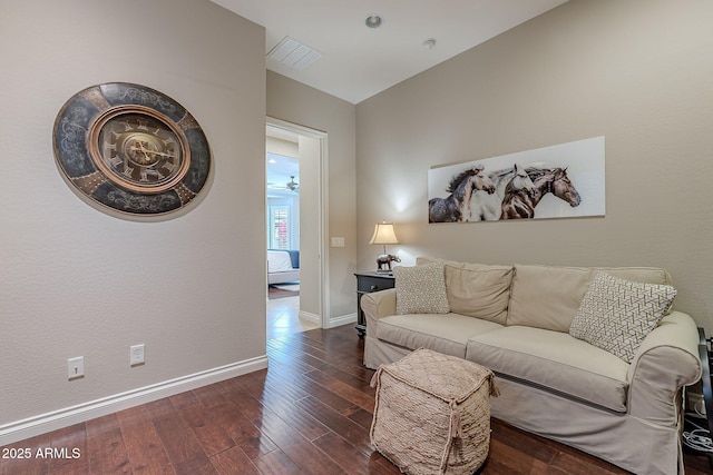 living room with ceiling fan, lofted ceiling, and dark hardwood / wood-style floors