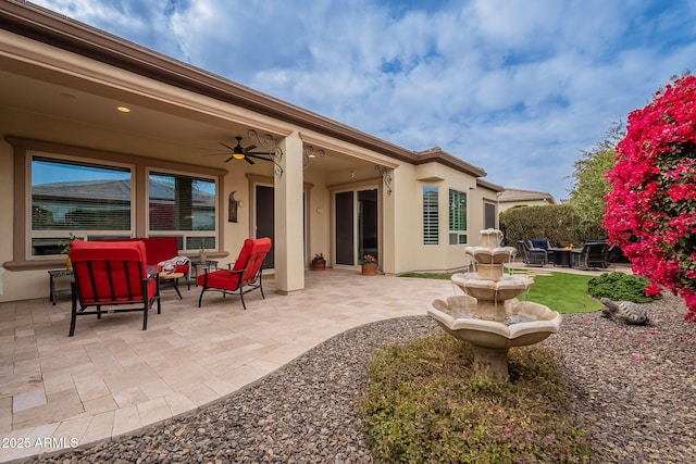 exterior space featuring an outdoor hangout area and ceiling fan