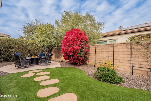 view of yard featuring a patio area and an outdoor fire pit