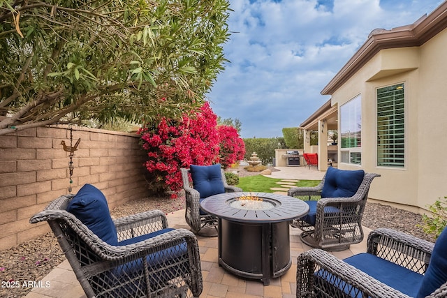 view of patio featuring an outdoor fire pit