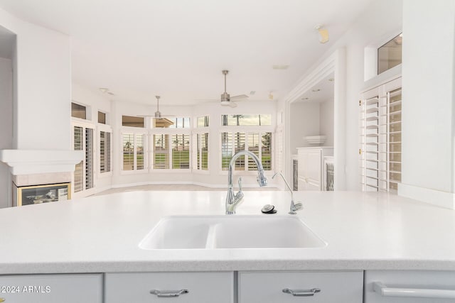 kitchen with ceiling fan and sink