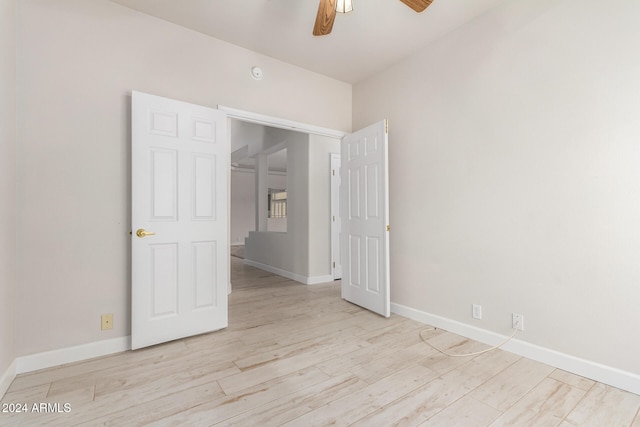 unfurnished bedroom featuring light hardwood / wood-style flooring and ceiling fan