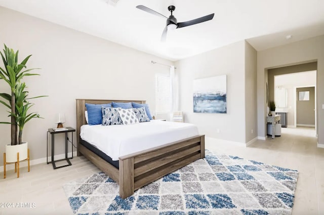 bedroom featuring ceiling fan and light wood-type flooring