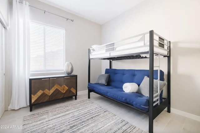 bedroom with light tile patterned flooring