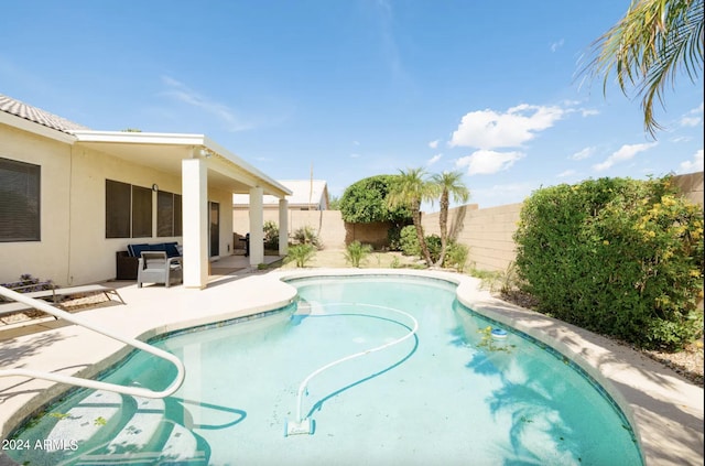 view of swimming pool featuring an outdoor living space and a patio