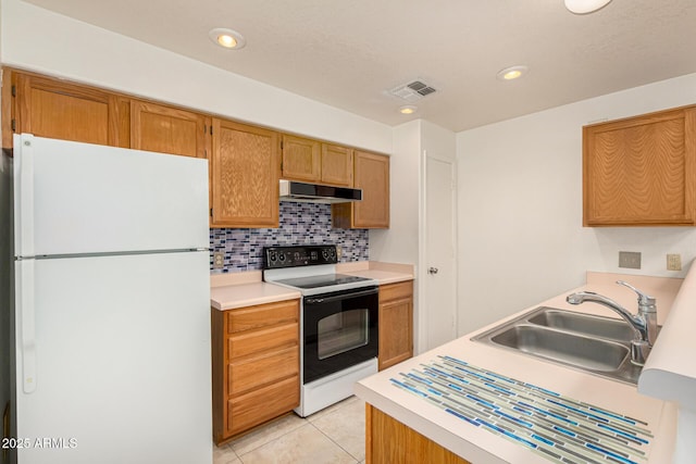 8140 N 107th Ave Unit 287, Peoria, AZ 85345 - kitchen featuring freestanding refrigerator, electric range oven, under cabinet range hood, a sink, and light tile patterned floors