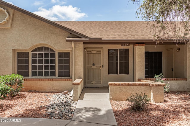 8140 N 107th Ave Unit 287, Peoria, AZ 85345 - view of exterior entry featuring roof with shingles and stucco siding