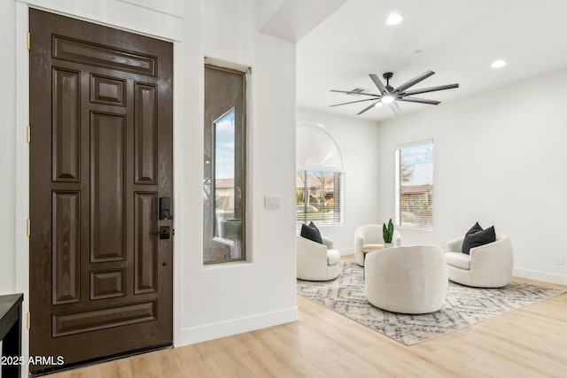 foyer entrance with recessed lighting, baseboards, light wood-type flooring, and ceiling fan