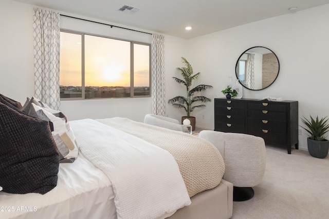 bedroom with light colored carpet