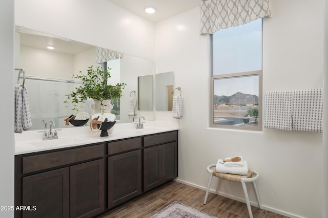 bathroom with a mountain view, vanity, and walk in shower