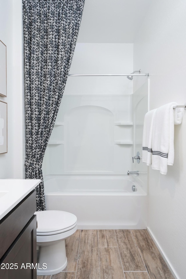 full bathroom featuring vanity, toilet, and shower / bathtub combination with curtain