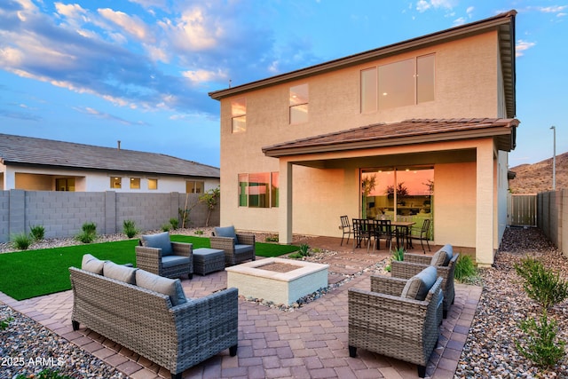 view of patio / terrace featuring an outdoor living space with a fire pit