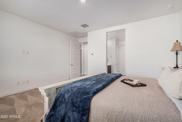 carpeted bedroom with ensuite bathroom