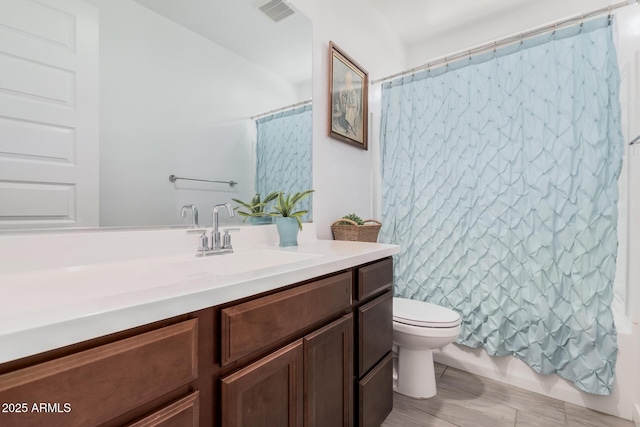 bathroom with vanity, a shower with curtain, and toilet