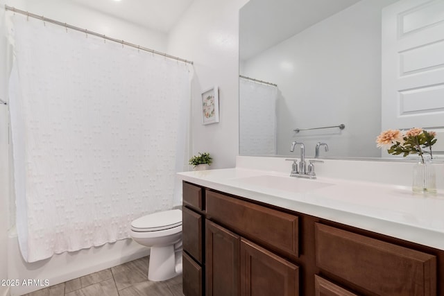 full bathroom featuring vanity, shower / bath combination with curtain, and toilet