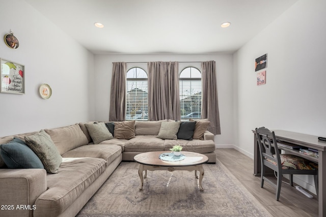 living room with light hardwood / wood-style flooring
