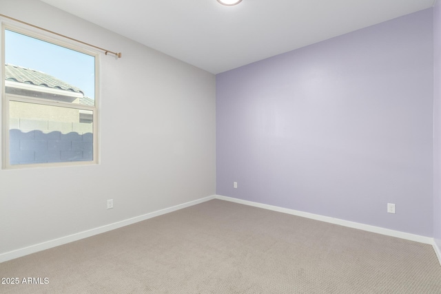 spare room with carpet floors