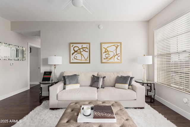 living room with dark hardwood / wood-style floors and ceiling fan