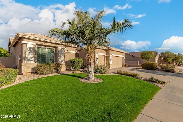 view of front facade featuring stucco siding, driveway, an attached garage, and a front yard