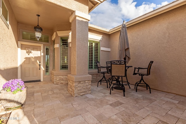 view of patio featuring outdoor dining area