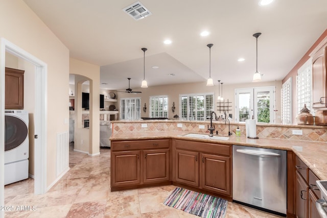 kitchen with a sink, dishwasher, washer / clothes dryer, visible vents, and ceiling fan