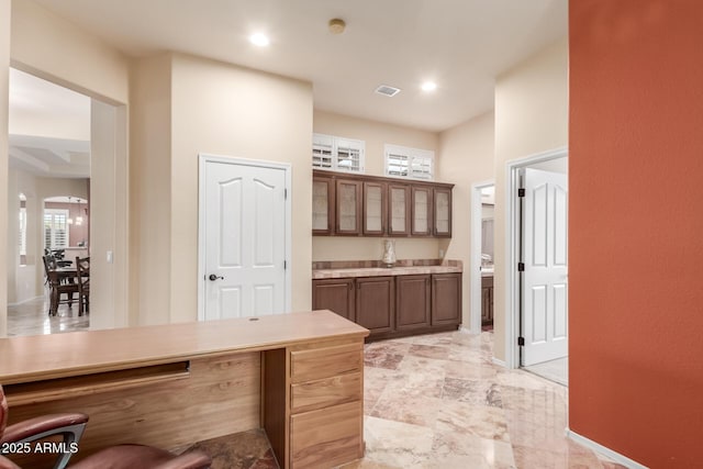 interior space featuring baseboards, visible vents, vanity, and recessed lighting
