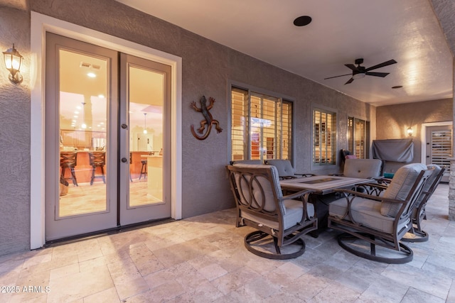 view of patio featuring visible vents, french doors, and a ceiling fan