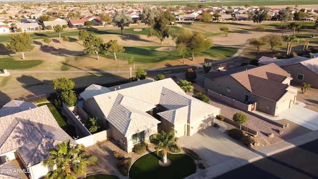 birds eye view of property with view of golf course and a residential view