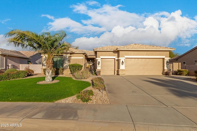 view of front of home featuring stucco siding, fence, driveway, a front lawn, and a garage