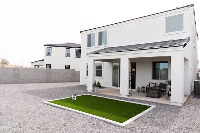 back of house with a patio, fence, and stucco siding