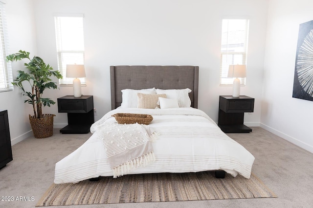 bedroom featuring carpet floors and baseboards