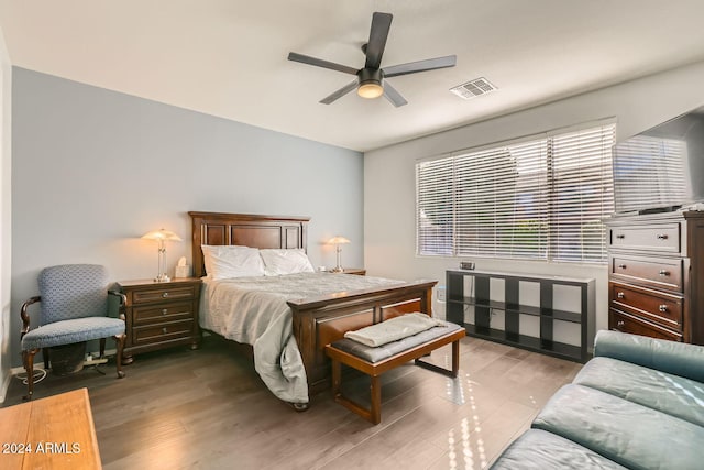 bedroom with ceiling fan and wood-type flooring