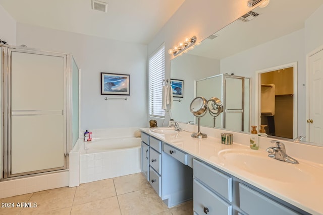 bathroom featuring tile patterned flooring, vanity, and separate shower and tub