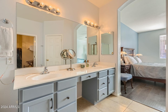 bathroom featuring tile patterned flooring and vanity