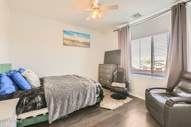 bedroom featuring ceiling fan and dark hardwood / wood-style flooring