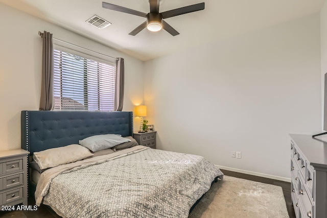 bedroom featuring ceiling fan and dark wood-type flooring