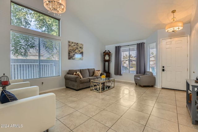 living room featuring a healthy amount of sunlight, light tile patterned floors, and an inviting chandelier