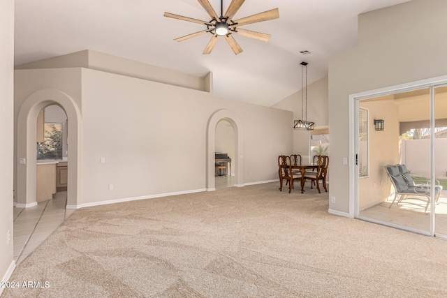 carpeted living room featuring high vaulted ceiling and ceiling fan