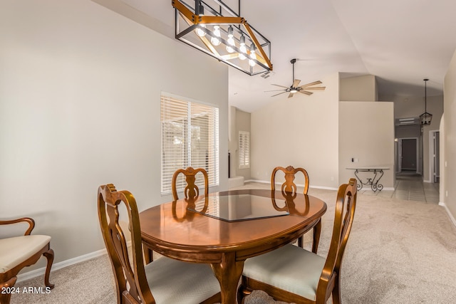 dining room featuring ceiling fan, carpet, and lofted ceiling