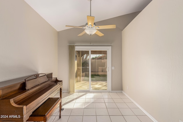 interior space with ceiling fan, light tile patterned flooring, and vaulted ceiling