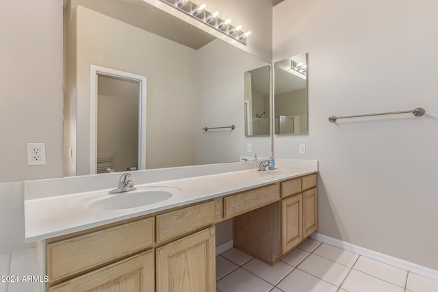 bathroom featuring tile patterned floors and vanity